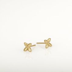 These are small gold earrings, gold flower studs. They are handmade of yellow 14k solid gold and have a shiny finish. Tiny and classy, these earrings are perfect for every day wear and will always be in style. A wonderful gift for yourself or for someone you love.14k solid gold ear backs are included.Size of the earrings is 5.3 x 5.8 mm = approx 0.2 x 0.22 inch* The earrings will be packed in a gift box ready to give as a gift *If you want to see more gold earrings click here: https://www.etsy.c Dainty Yellow Gold Earrings With Flower Charm, 14k Gold Flower Charm Earrings, Dainty Yellow Gold Flower Earrings For Gifts, Dainty 14k Gold Flower Earrings, Dainty 14k Yellow Gold Flower Earrings, Dainty Yellow Gold Flower Earrings, Delicate Yellow Gold Flower Shaped Earrings, Delicate Yellow Gold Flower Earrings, Minimalist Flower Earrings For Anniversary