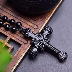 As a gift for your loved ones, this limited-stock Sterling Silver Obsidian Cross Pendant Necklace will be perfect!THE SYMBOL OF OBSIDIANObsidian is a naturally occurring volcanic glass with minimal crystal growth as the molten lava cools rapidly. It is composed primarily of silica and lacks a crystalline structure, giving it a smooth and glassy appearance. Obsidian is usually black in color, but can also appear in shades of brown, gray or green.It is also believed to enhance intuition and provide clarity of thought. It is often used in divination practices and meditation to gain deeper insight and to connect with ones inner wisdom.SPECIFICATIONSMetal Type: 925 Sterling SilverStyle: VintageChain Length: 600 mm (23.6 in)Pendant Size: 54*38*9 mm (2.12*1.50*0.35 in)Pendant Weight: 29 gWith Pay Black Resin Pendant Jewelry, Black Agate Jewelry For Gifts, Spiritual Obsidian Necklace As Gift, Onyx Cross Jewelry Gift, Onyx Cross Jewelry As A Gift, Silver Obsidian, Jesus Necklace, Crystal Growth, Jesus Cross