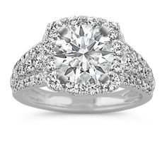 a diamond engagement ring with double halos