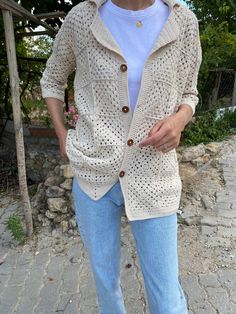 Crocheted handmade unisex shirt jacket suits your vintage style with its stylish look. Quality soft cotton thread is used. It will be your choice for daily use and festivals where you will reflect your minimal style. Please contact for different basic colors and sizes.          Cardigan Sizes Width 120 cm / 47,2 inches Height 70 cm / 27,5 inch **It will be custom made for your size** Model Size: 178 cm / 5 Feet 10.79 Inches / 63 kg - 138 lb.     washing information It can be washed in the hand w Casual Handmade Long Sleeve Top, Vintage Cotton Cardigan For Summer, Casual Handmade Winter Tops, Vintage Cotton Summer Cardigan, Casual Handmade Cotton Sweater, Handmade Casual Fall Tops, Vintage Crochet Outerwear For Spring, Casual Cream Crochet Cardigan, Fitted Crochet Cotton Outerwear