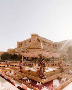 an elaborately decorated fountain in front of a castle