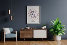 a living room with blue walls and wooden flooring, two chairs and a plant in the corner