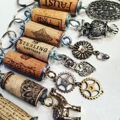 wine cork keychains are arranged on a table