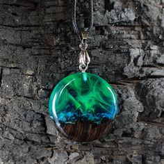 Aurora borealis necklace, northern lights pendant, green opal necklace, resin aurora pendant, glowing necklace, birthday gift, gift for her Everything is made naturaly from wood, resin and inspire, we use rare types of tropical woods which has miracle grain and put with resin to make inspiring jewelery. The resin has doesnt effect from water, so you can swim in the sea or pool as you wish. İf needed you may clean this piece with dry soft cotton cloth or you can care wood with olive oil or someth Unique Handmade Necklaces For Birthday, Unique Handmade Birthday Necklaces, Nature-inspired Round Jewelry For Crafting, Handmade Round Necklace For Birthday, Nature-inspired Multicolor Round Jewelry, Handmade Resin Jewelry For Birthday, Green Round Jewelry For Birthday, Resin Necklace As Gift, Green Pendant Jewelry For Birthday