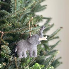 an elephant ornament hanging from a christmas tree