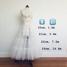 a mannequin is standing next to a white wall with measurements for the skirt