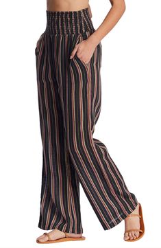 Perfect for casual days spent strolling the boardwalk, this pair of wide-leg pants is fashioned with a stripe pattern and smocked waist. 31 1/2" inseam; 23" leg opening; 13" front rise; 16" back rise (size Medium) Smocked waist Side-seam pockets; back patch pockets 100% cotton Hand wash, line dry Imported Women's Clothing Striped Wide Leg Trousers With Elastic Waistband, Casual Pinstripe Wide Leg Bottoms, Pinstripe High-waisted Pants For Summer, Summer Pinstripe High-waisted Pants, Casual Pinstripe Wide-leg Bottoms, Striped Straight Leg Bottoms With Elastic Waistband, Relaxed Fit Striped Wide Leg Pants For Spring, Striped Wide-leg Pants With Elastic Waistband, Pinstripe Wide Leg Summer Bottoms