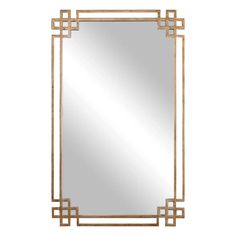 a gold framed mirror with an art deco design on the front and back, against a white background