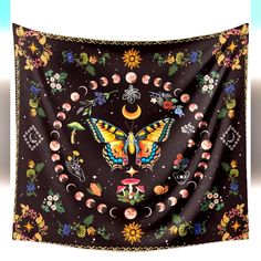 a butterfly and moon tapestry hanging on a wall