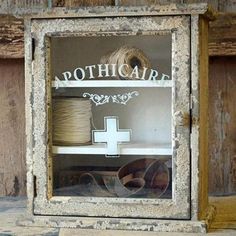 an old wooden medicine cabinet with the word toothpick on it's side