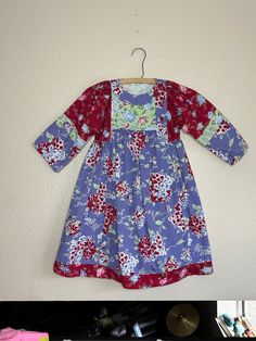 Vintage floral hydrangea multi colored dress. Maker- Mouse Feathers Size- kids 6x Length- 28 1/2  Sleeve- 14 1/2 in  Width- 14 in ptp Excellent vintage condition. Fitted Multicolor Floral Dress, Long Sleeve Floral Print Dress For Dress-up, Red Floral Patchwork Dresses For Spring, Multicolor Floral Print Dress-up Dresses, Multicolor Floral Print Dresses For Dress-up, Red Floral Print Dress For Playtime, Long Sleeve Cotton Dress With Floral Patchwork, Fitted Patchwork Dress For Dress-up, Fitted Multicolor Floral Cotton Dress