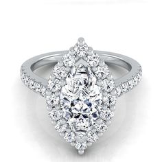 an oval cut diamond ring with halos and pave set shoulders