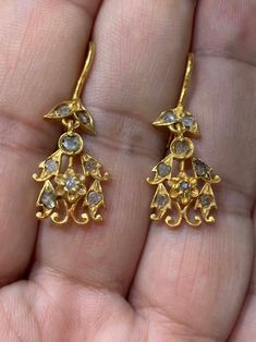 Antique Polki Diamond Chandelier Earrings -Total weight : 3.1 g. -Material : gold -Polki Diamond This Earrings is antique crafted by hand over 60 years. Please contact us if you have any questions. ABOUT PERANAKAN JEWELRY Peranakan jewelry is rare and skilfully crafted traditional gold providing a pedestal for Diamond and other precious stones to be mounted on. Each crafted piece holds the mystery of the individual who owns it and embraces an era in Baba history. Peranakan jewelry is fashioned w Gold Diamond Dangle Earrings Hand Set, Gold Hand Set Dangle Diamond Earrings, Traditional Yellow Gold Chandelier Earrings For Formal Occasions, Gold Dangle Diamond Earrings Hand Set, Elegant Ceremonial Danglers Drop Earrings, Elegant Ceremonial Drop Danglers, Elegant Drop Danglers For Ceremonial Occasions, Traditional Gold Hand Set Chandelier Earrings, Yellow Gold Chandbali Earrings For Anniversary