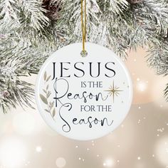 jesus is the reason for the season ornament hanging on a christmas tree branch