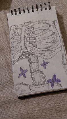 a drawing of a skeleton with purple butterflies on it