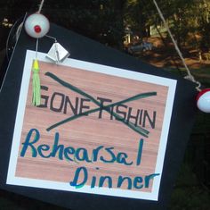 a sign that says gone fishin, rereasal dinner hanging from a rope