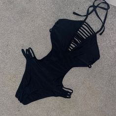 Black One Piece - Never Worn Bikini Black Strappy Swimwear For Summer, Black Summer Party Swimwear, Black Swimwear For Beach Season And Club, Black Swimwear For Club During Beach Season, Black Triangle Top Swimwear With Cutout, Black Cutout Triangle Top Swimwear, Trendy Black Party Swimwear, Chic Black Strappy Swimwear, Black Summer Swimwear For Night Out