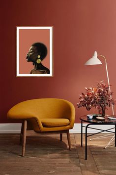 a living room with red walls and a yellow chair in front of a painting on the wall