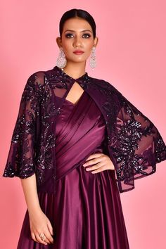 Wine draped saree gown with sweetheart neckline. Paired with sequin embroidered cape in floral pattern. - Aza Fashions Draped Saree Gown, Cape Women, Gown With Cape, Saree Gowns, Dhoti Saree, Cotton Sarees Handloom, Cape For Women, Embroidered Cape, Satin Embroidery