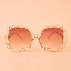 Add a touch of grooviness to your look with our Sofia Sunglasses in Champagne! These cute sunnies sport a playful clear and tan frame with a peachy gradient lens, making them a playful and eye-catching addition to any outfit. Trendy Clear Sunglasses With Tinted Lenses, Trendy Clear Sunglasses With Gradient Lenses, Trendy Clear Sunglasses With Uv Protection, Trendy Clear Sunglasses For The Beach, Trendy Clear Sunglasses For Beach, Trendy Clear Sunglasses For Spring, Clear Polarized Sunglasses For Spring, Chic Clear Sunglasses For Summer, Chic Clear Sunglasses For Spring