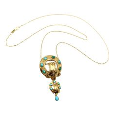 This is part of Chairish’s Fine Jewelry assortment.  This is a fantastic 14 karat gold and turquoise Etruscan Revival pendant necklace from the Victorian era. It features detailed hand engraved gold and fabulous turquoise cabochons with movement from dangling elements.  Etruscan Revival jewelry has a rich and interesting history. In the early 1800's there was a large excavation of Etruscan tombs outside of Rome. Within these tombs were pieces of original Etruscan jewelry. The Etruscans were master artisans; they created breathtaking pieces of jewelry through their use of gold wire and beading, colored gemstones, and glass. The news of the excavation of these tombs, and the treasures contained inside them, spread throughout Europe. Etruscan style jewelry captured the imagination of the publ Etruscan Jewelry, Cabochon Necklace, Interesting History, Gold Wire, Hand Engraving, Victorian Era, Turquoise Stone, Gemstone Colors, Jewelry Art