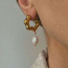 Indulge in luxury with Celine. With a modern twist on a classic design, these pearl earrings make an elegant statement and are sure to turn heads. Gold Plate 20mm Outer Diameter 1.5" Drop Waterproof & Tarnish Resistant Nickel- & Lead-Free Modern Gold Earrings With Pearl Chain, Modern Pearl Chain Earrings As Gift, Modern Gold Earrings With Pearl Pendant, Modern Pearl Chain Earrings, Modern Single Pearl Earring In Metal, Pearl Pendant Earrings, Pearl Drop Earrings Gold, Jewelry Card, Everyday Luxuries