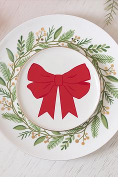 Add a festive touch to your table with our Red Bow Appetizer Plate. Featuring a delightful red bow design and a luxurious gold rim trim, this plate brings elegance and fun to your seasonal gatherings. Perfect for appetizers, desserts, or small bites, it's a beautiful way to elevate your holiday table and impress your guests. Record Painting, Christmas Party Decor, Appetizer Plate, Night Before Christmas, Ceramic Gifts, Appetizer Plates, Bow Set, Festive Decor, Small Bites