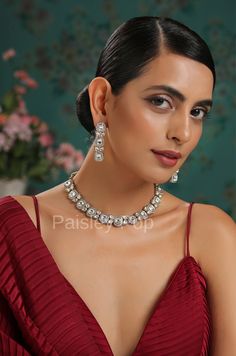 An elegant and classic Polki necklace set is the design that offers delicate hints of traditional legacies and Victorian art form of zirconia setting to bejewel your neckline. Embedded with high-grade Polkis this beauty is designed and handcrafted by artisans of India with traditional jewelry-making techniques. Embellish your appearance with our Polki-inspired necklace that has a resemblance to Bollywood jewelry. Add this charm of Indian Jewelry to your wardrobe and see the heads turn. A perfect Festive Kundan Necklace With Matching Earrings For Formal Occasions, Festive Diamond Jewelry Sets With Matching Earrings, Elegant Sterling Silver Jewelry Sets For Festive Occasions, Festive Formal Crystal Jewelry Sets, Formal Hand Set Kundan Necklace, Silver Kundan Necklace With Elegant Cubic Zirconia Design, Dazzling Silver Kundan Necklace With American Diamond, Elegant Festive Kundan Necklace, Hand Set, Elegant Silver Kundan Necklace In Sterling Silver