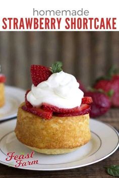 homemade strawberry shortcakes with whipped cream on top and strawberries in the background