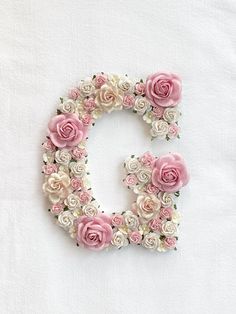 the letter d is made up of pink and white flowers