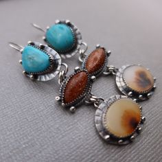 Manassas Turquoise, Sunstone and Dendritic Agate set in sterling silver.  These earrings measure slightly over 2 3/4 inches long and 3/4 inches wide at the widest point.  All components are sterling silver and have been oxidized and polished.  Each earring weighs:  10.4 grams Thanks for shopping!! Southwestern Silver Earrings With Natural Stones, Southwestern Sterling Silver Gemstone Jewelry, Nickel-free Oval Agate Jewelry, Turquoise Cabochon Drop Earrings, Silver Chrysocolla Jewelry With Natural Stones, Turquoise Cabochon Dangle Jewelry, Turquoise Agate Teardrop Jewelry, Southwestern Style Jewelry With Oval Natural Stones, Turquoise Teardrop Agate Jewelry