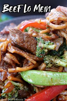 beef lo mein with broccoli and peppers in a bowl