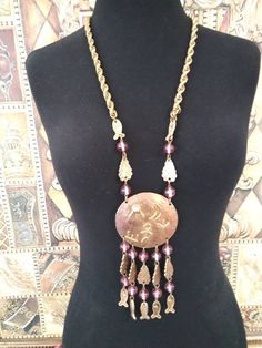 ON SALE Huge Earth motif statement beaded tassel necklace. Chain measures approximately 32 in Long and the huge pendant measures right around 7 in Long by 3 inches wide. In very good vintage condition. Has a really fun motif of the Sun Moon grass tree and man on it. Has one little tiny spot on the back that has some slight gold tone loss. Really is a fun piece and definitely will get noticed. Leopard Handbag, Grass Tree, Fringe Jewelry, Beaded Clutch Purse, Desert Hot Springs, Beaded Tassel Necklace, Old Hollywood Glam, Beaded Clutch, 1960s Fashion