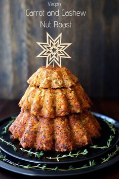 carrot and cashew nut roast on a black plate with the title vegan carrot and cashew nut roast