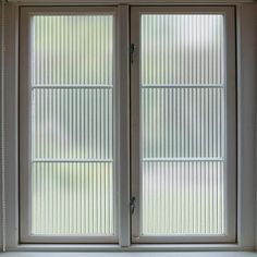 an open window with blinds on the outside and in between it's two sides