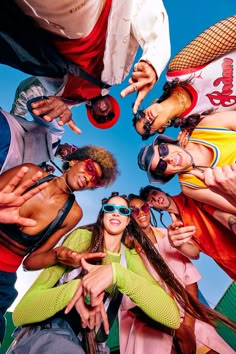 a group of young people standing in a circle