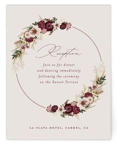 a wedding reception card with flowers and leaves on the front, in burgundy and white