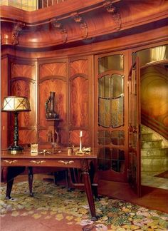 a large wooden desk sitting in the middle of a room