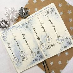 two notebooks with christmas ornaments on them next to a ribbon and some silver bows