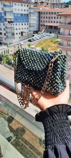 ✨ Introducing our dazzling handmade crystal bag, perfect for adding a touch of sparkle to any outfit! This stunning bag is crafted from over 1200 metallic green 8mm crystals, making it a true statement piece. Weighing in at 650 grams, it feels substantial and luxurious. Whether you're heading to a party, a night out, or just want to shine bright wherever you go, this bag is your perfect companion. Its intricate design and shimmering crystals will catch everyone's eye and make you feel like a star. 🌟 The golden chain adds an extra touch of elegance, complementing the beautiful green crystals. It's the ideal blend of glamour and sophistication. Get ready to turn heads and make a sparkling statement with this unique, handmade crystal bag! ✨👛 Silver Beaded Crystal Bags, Silver Crystal Beaded Bags, Rhinestone Bag, Hand Beaded Bag, Bridal Purse, Crystal Bags, Evening Clutch, Beaded Bags, Crystal Pearls