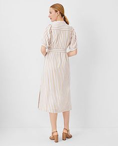 Elevate your wardrobe with the Ann Taylor Striped Puff Sleeve Midi Shift Dress, a perfect blend of classic charm and modern sophistication. This dress features a distinctive stand collar and a flattering split neck, complemented by short puff sleeves with shirred caps and elasticized cuffs for a touch of elegance. The self-tie belt cinches the waist, enhancing the silhouette, while the lined body ensures comfort and coverage.

- **Size**: Regular - 10
- **Color**: Baguette
- **Material**: 100% P Short Sleeve Dresses With Vertical Stripes For Work, Striped Midi Dress For Work, Striped Knee-length Midi Dress For Work, Elegant Striped Midi Dress For Daywear, Striped Midi Dress For Work In Spring, Elegant Vertical Stripes Dress For Day Out, Elegant Dresses With Vertical Stripes For Day Out, Chic Vertical Stripe Midi Dress For Work, Spring Knee-length Midi Dress With Vertical Stripes