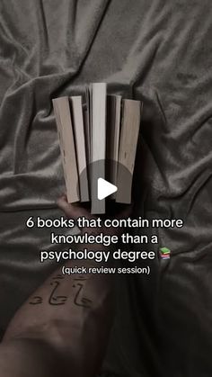 someone is reading a book on their bed with the caption, 6 books that contain more knowledge than a psychic degree