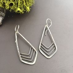 Minimalist sterling silver dangle earrings with a geometric Art Deco design. These are sleek and simple, while still being bold enough to really stand out....and they go with everything! Geometric Sterling Silver Earrings With Ear Wire, Sterling Silver Geometric Earrings With Ear Wire, Everyday Geometric Sterling Silver Earrings, Sterling Silver Geometric Earrings, Modern Silver Triangle Earrings, Silver Geometric Jewelry For Everyday Wear, Modern Everyday Diamond-shaped Jewelry, Modern Diamond-shaped Everyday Jewelry, Modern Nickel-free Triangle Earrings