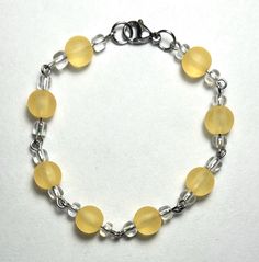 A pretty yellow beaded bracelet on silver wires. This bracelet reminds me of sunflowers. 🌻 Yellow Beaded Bracelet, Yellow Bracelet, Pretty Yellow, Bracelet Ideas, Jacksonville Fl, Silver Wire, Beaded Bracelet, Halloween Shopping, Beauty Book