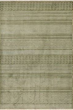 a green and white rug with lines on it