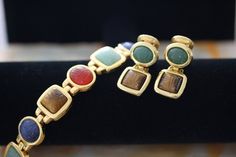 KJL Egyptian Modern Vintage Art Glass Bracelet and Clip on Earrings. Formal Gold Lucite Jewelry, Multicolor Clip-on Jewelry For Evening, Multicolor Clip-on Evening Jewelry, Elegant Lucite Jewelry For Formal Occasions, Liquid Smooth, Modern Vintage Art, Vintage Art Glass, Glass Bracelet, Glass Earrings