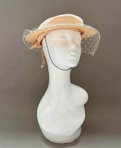 "Classic vintage hat. Perfect for Ascot, weddings, special occasions, very elegant. Comes with elastic to hold hat in place. Condition: vintage perfect Colour: peach  Label: Made in England Material: polyester Size: M inner circumference aprox. 21.5-22 inches, circumference 44\"\" *Please note all hats come securely packed in a box *All our vintage items come in clean and best condition possible *Please note all hats come securely packed in a box *All our vintage items are top quality authentic vintage accessories from private collections as well as ex-stage items from acclaimed milliners and manufactures. Accessories come in clean and best condition possible. PLEASE READ CAREFULLY We are trying hard to provide our customers with an excellent service and bring quality and rare vintage to t Beige Cloche Hat For Wedding, Cream Brimmed Cloche Hat For Evening, Beige Cloche Hat For Church, Cream Brimmed Costume Hats For Evening, Cream Brimmed Costume Hats And Headpieces For Evening, Cream Brimmed Evening Costume Hats And Headpieces, Cream Cloche Hat For Evening, Cream Brimmed Evening Costume Hat, Cream Cloche Hat With Short Brim For Church