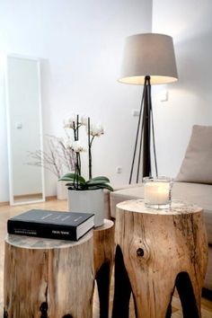 two wooden stools sitting next to each other on top of a hard wood floor