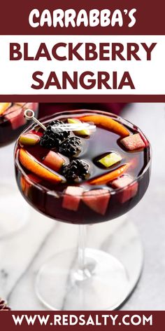 a close up of a drink in a glass on a table with the words caraba's blackberry sangria