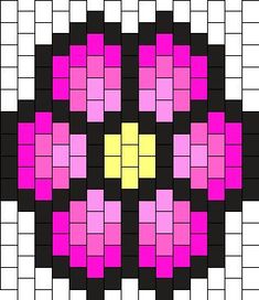 a cross stitch pattern with pink and yellow squares in the shape of an abstract flower